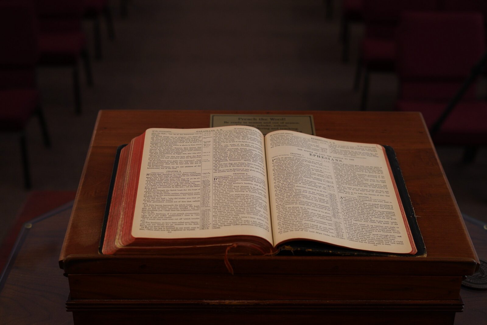 An open Bible resting on the pulpit